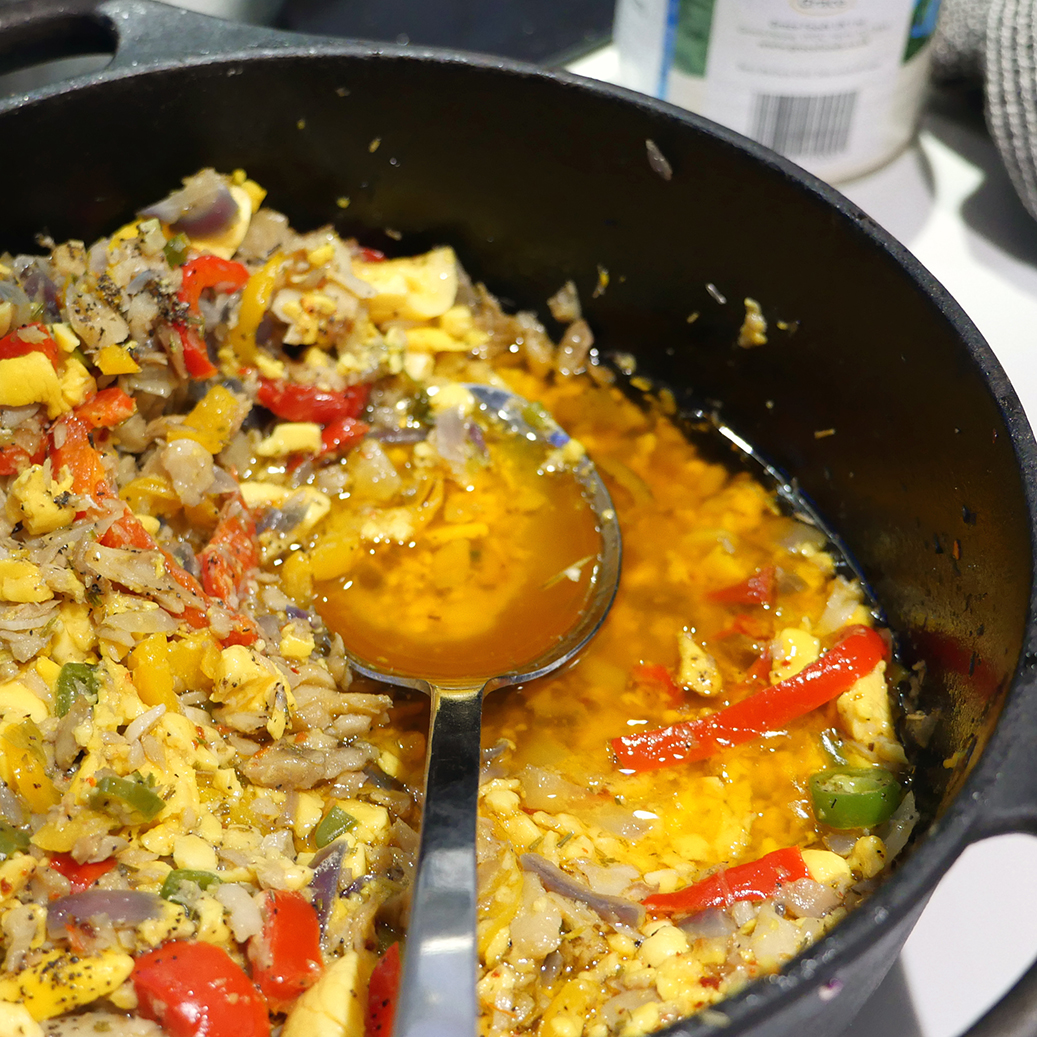 Cooking saltfish and ackee.